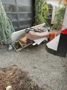 Same-day junk pickup service loading yard debris and discarded items in Oregon